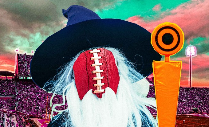 A football dressed in a wizard's hat and a long, white beard, with a football stadium in the background.